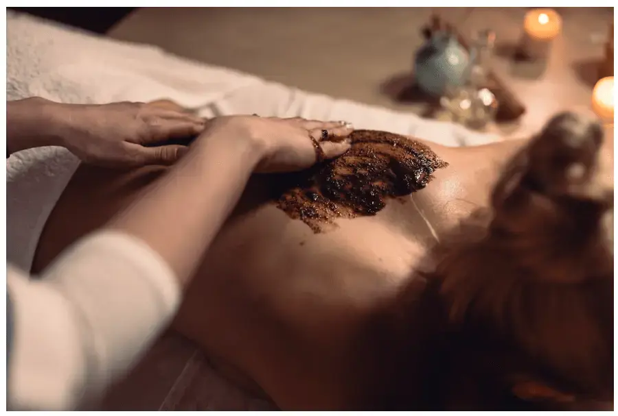 A woman receiving a chocolate massage.